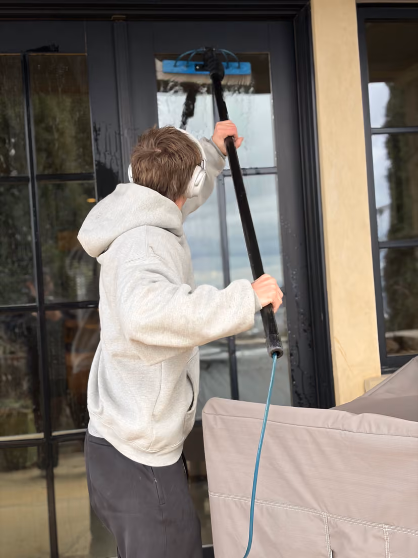 Water-Fed Pole Cleaning on a Glass Door